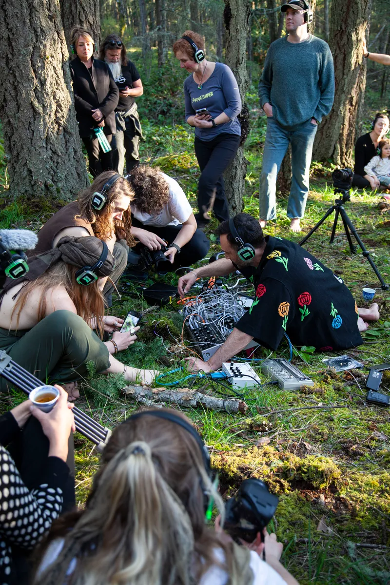 Modern Biology making music amongst listeners in the woods